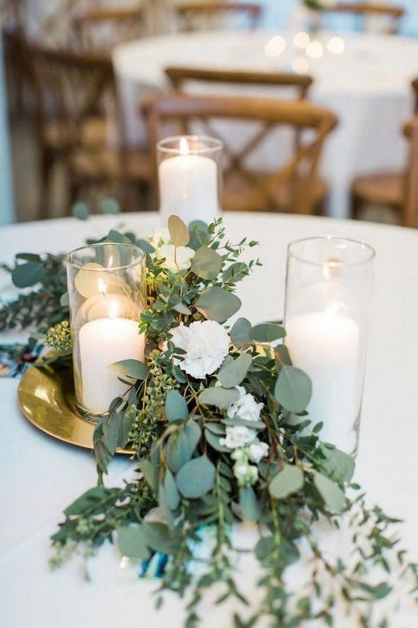 Eucalyptus and candles wedding centerpiece