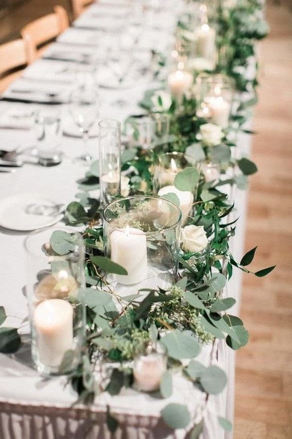 Eucalyptus and candles wedding table decor