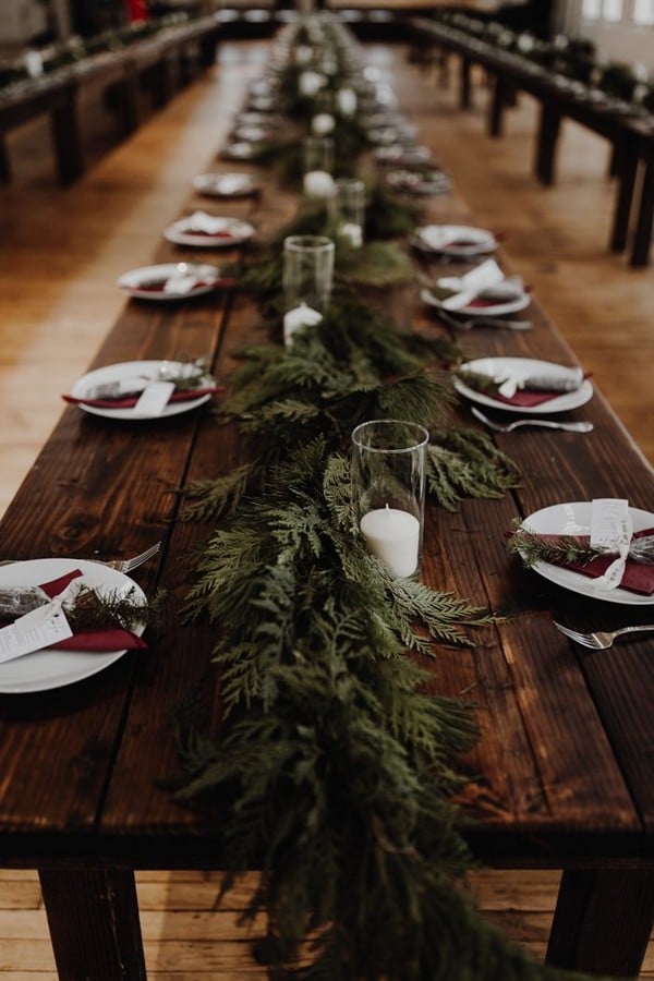 Evergreen garland table decor via Image by Olivia Strohm Photography