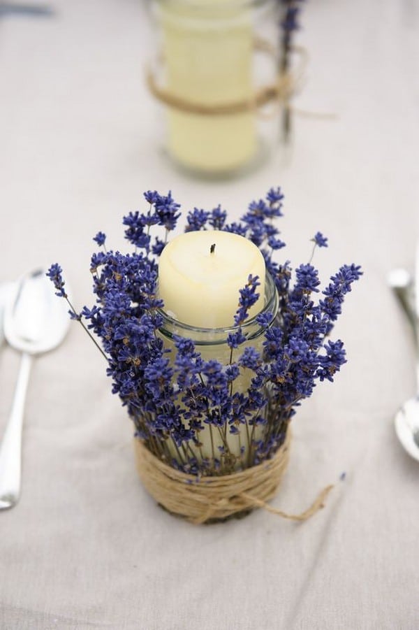 a jar with a pillar candle wrapped with lavender and twine -- could do with those mosquito candles