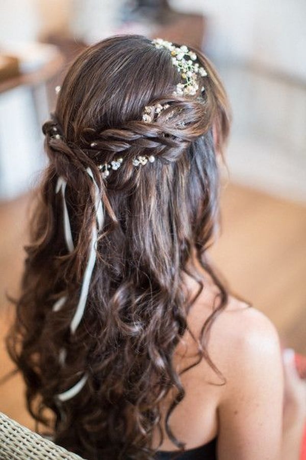 braided half up half down wedding hairstyle with flower crown