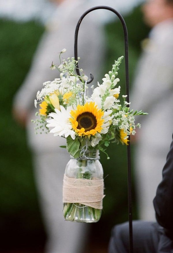 chic wedding aisle decorations with mason jars and sunflowers