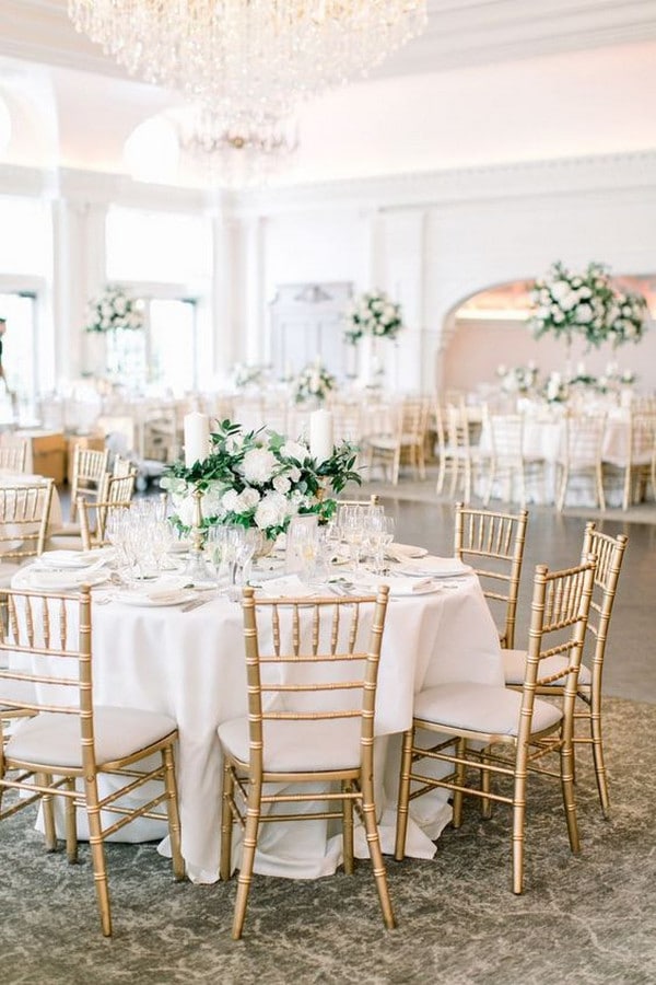 classic round table wedding reception ideas with gold chairs