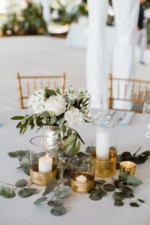 classic white and greenery candle wedding centerpiece