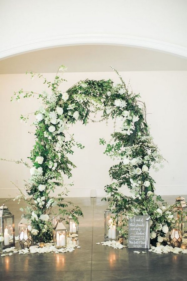 elegant greenery wedding arch ideas with lanterns