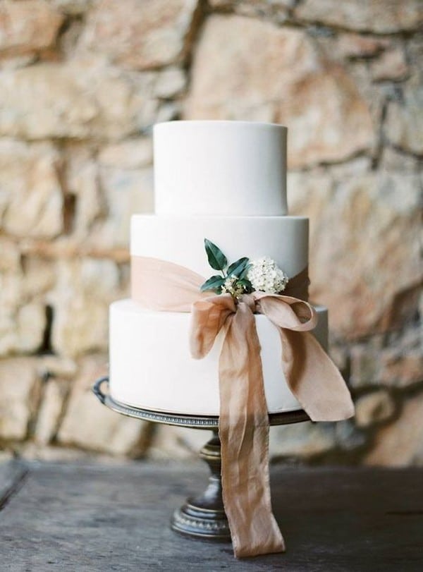 elegant wedding cake with dusty pink ribbon