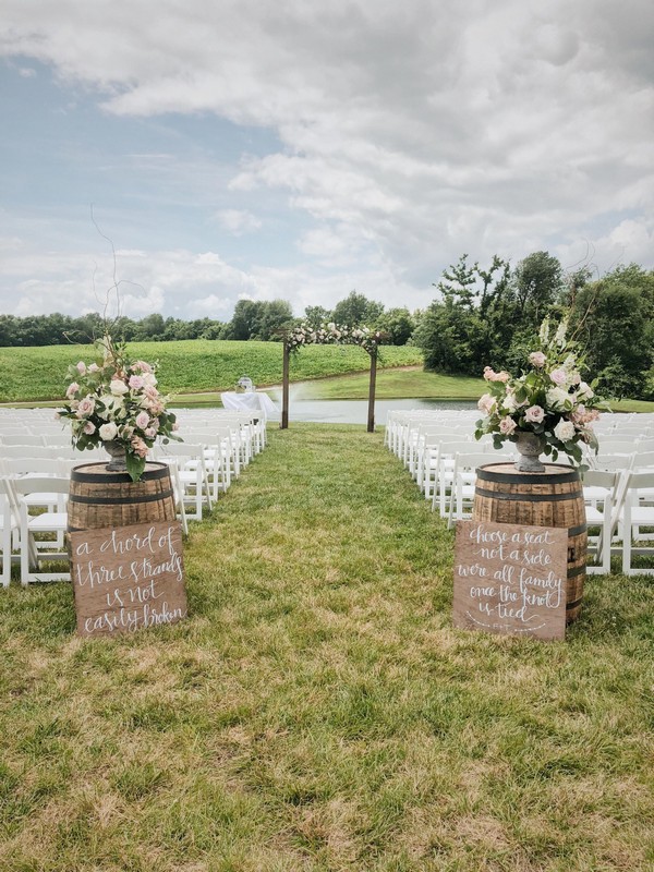 outdoor country farm wine barrel wedding entrance decor