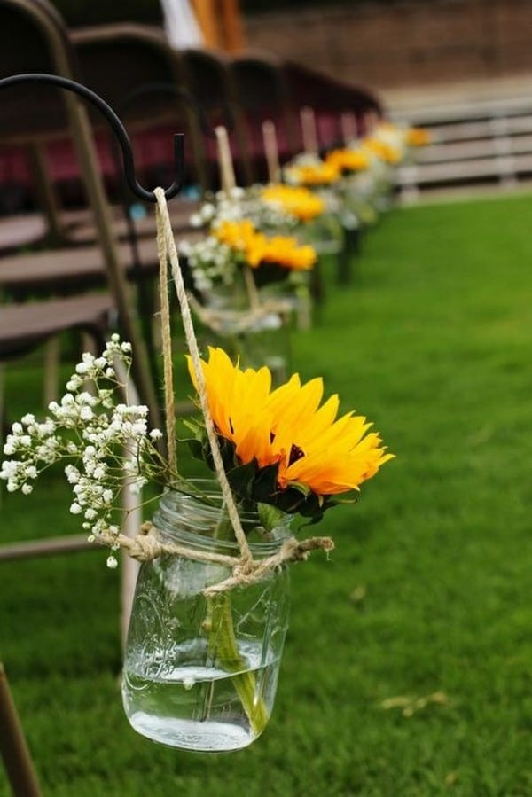 outdoor wedding aisle decorations with mason jars and sunflowers