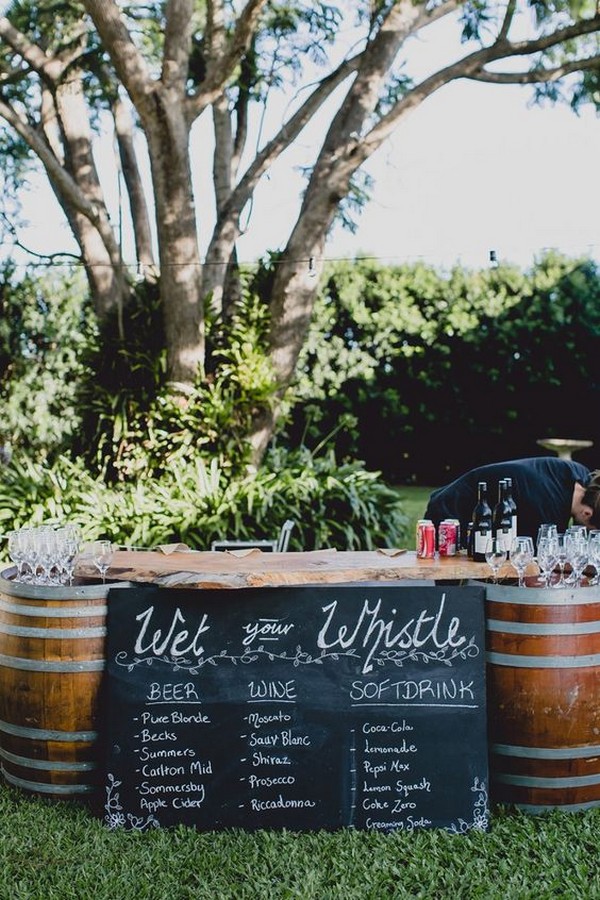 outdoor wedding drink station with wine barrels