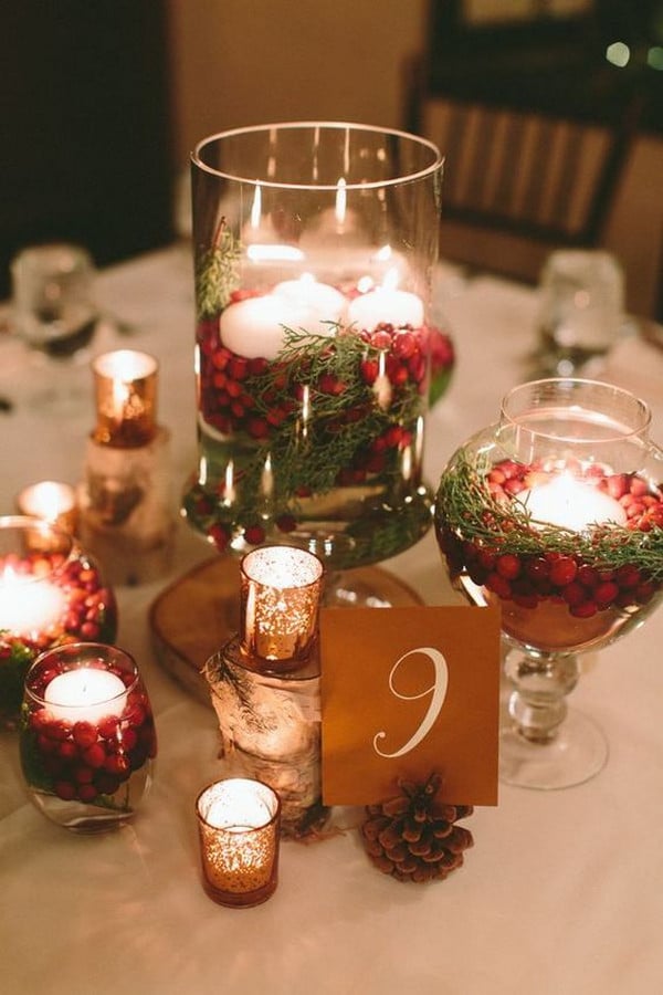 red and green winter wedding centerpiece with candles