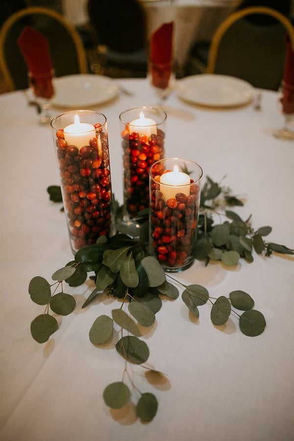 red and green winter wedding centerpiece