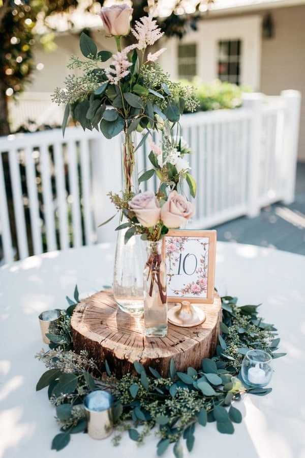 rustic dusty rose wedding centerpiece with tree stumps