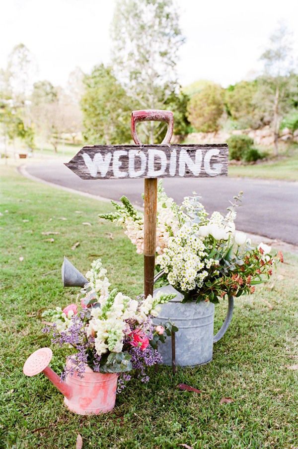rustic garden watering can wedding sign
