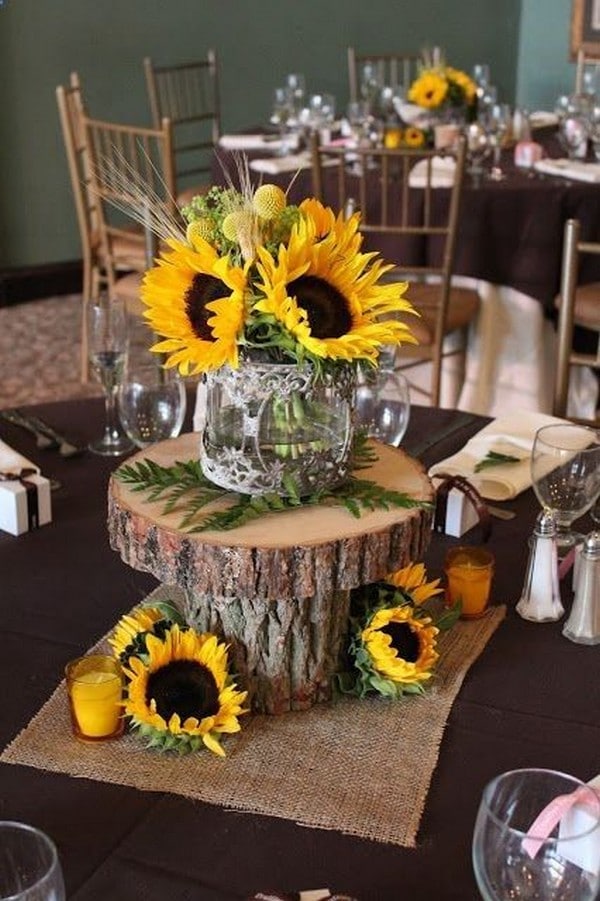 rustic sunflowers wedding centerpiece with tree stump