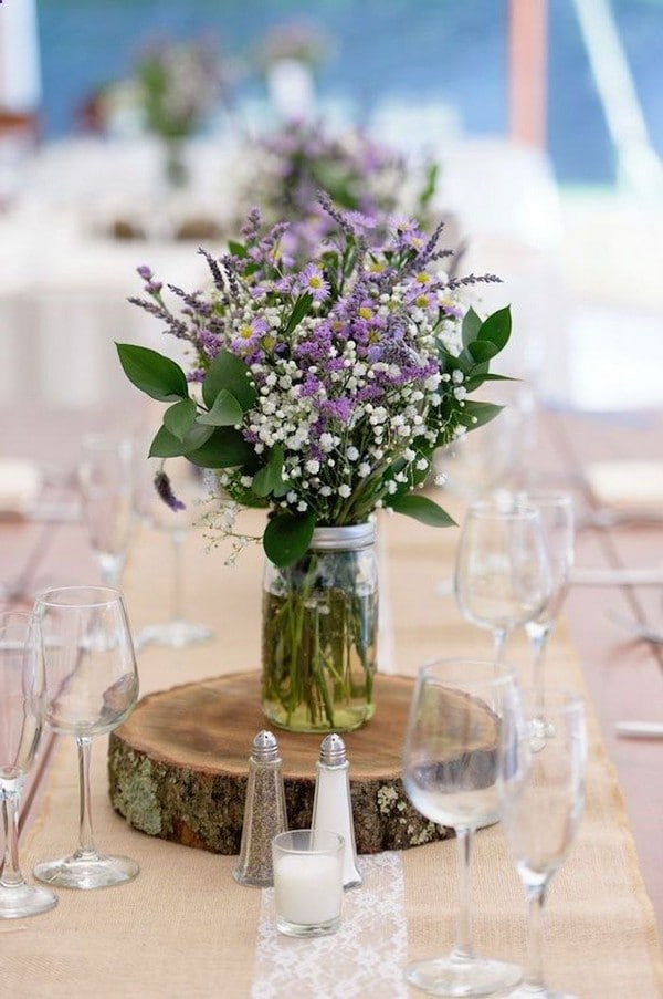 rustic tree stump and lavender wedding centerpieces