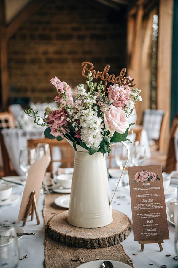 rustic watering can wedding centerpiece