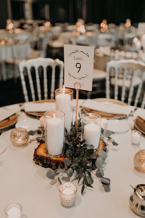 rustic wedding centerpiece ideas with candles greenery and tree stumps