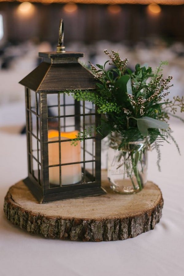 rustic wedding centerpiece with lantern and greenery