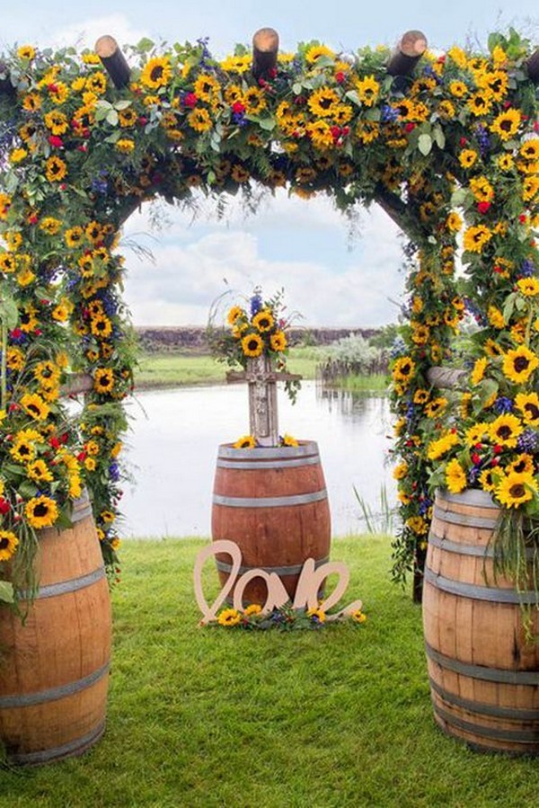 sunflowers and wine barrel wedding backdrop