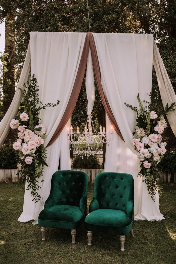 vintage garden wedding backdrop with hand-opened roses, velvet green chairs
