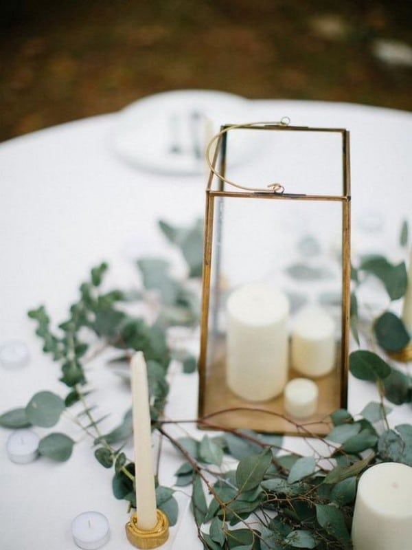 wedding centerpiece with greenery and lantern