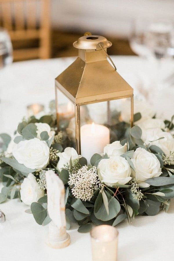 white and greenery wedding centerpiece with gold lantern