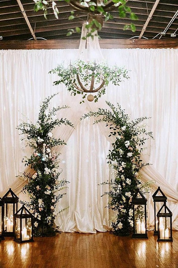 white and greenery winter wedding backdrop