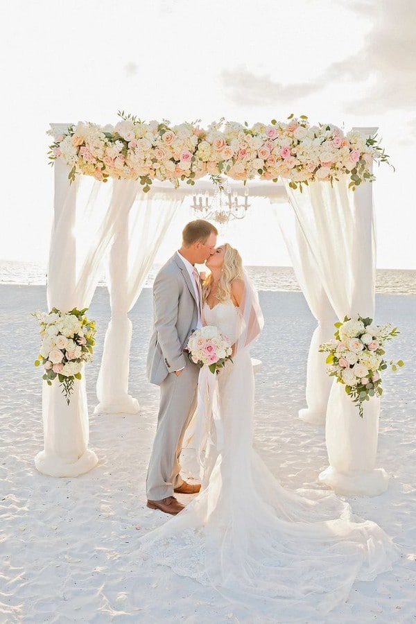 white and pink roses beach wedding arch backdrop