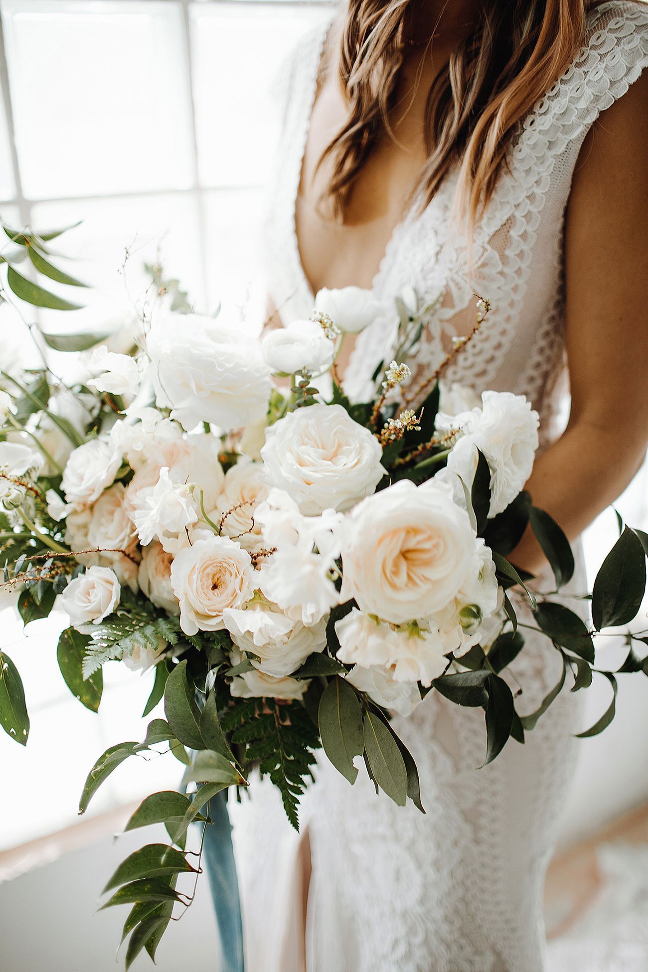 white peach and greenery wedding bouquet