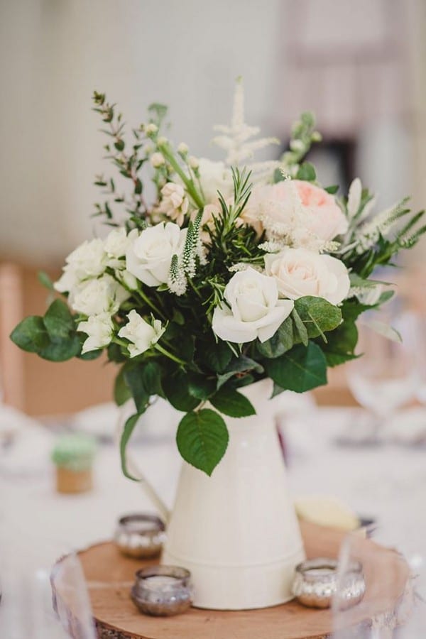 white watering can and roses wedding centerpiece