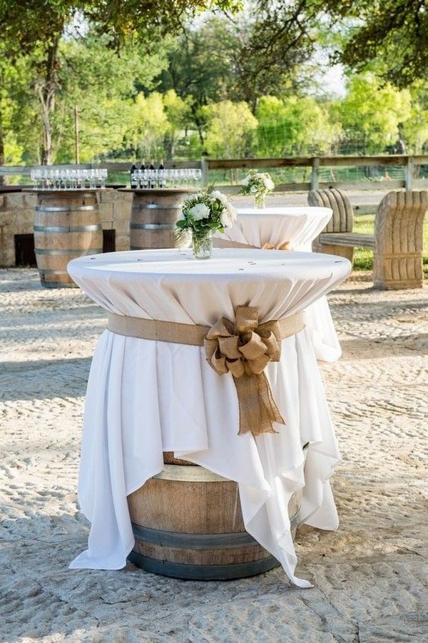 wines barrels as outdoor wedding cocktail tables