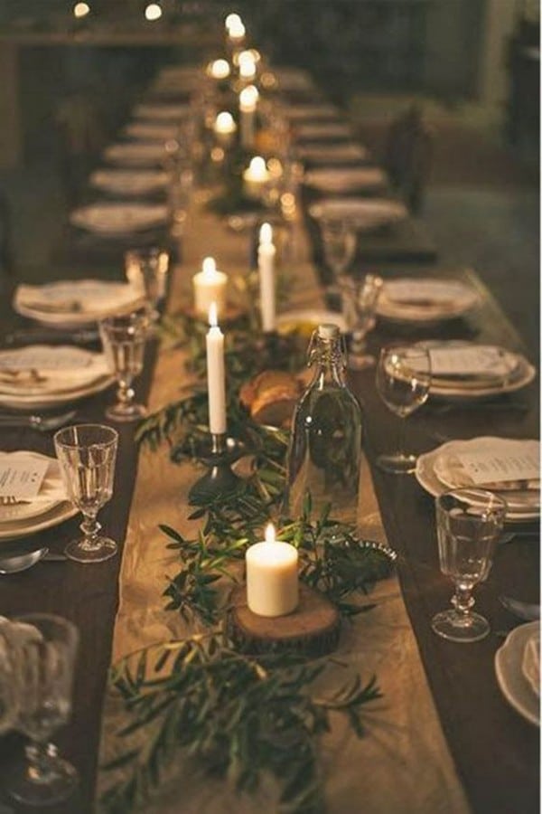 winter candle and greenery wedding centerpiece