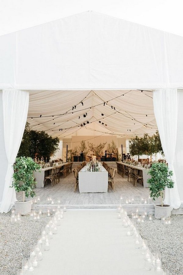 elegant tent wedding reception entrance with candle lights