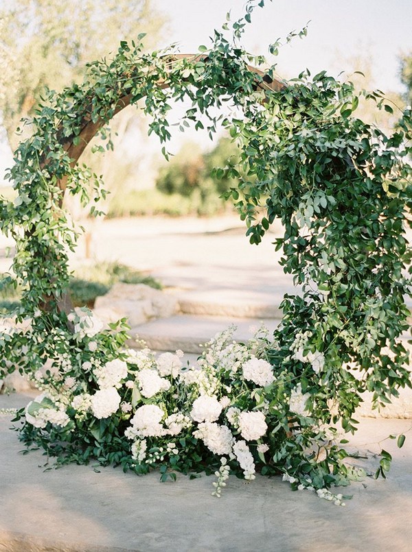 Ceremony round circular arch with smilax & white flowers