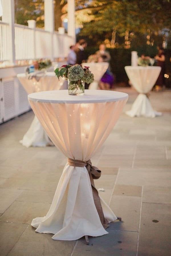 Neutral ivory wedding cocktail table with lighting