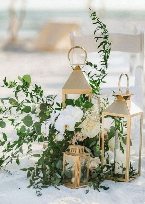 beach wedding aisle decoration ideas with lanterns and greenery