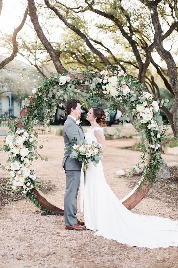 chic outdoor floral and wooden circular wedding arch