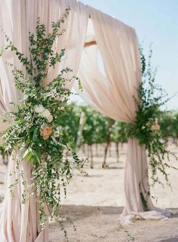 draped romantic blush and greenery wedding ceremony arch