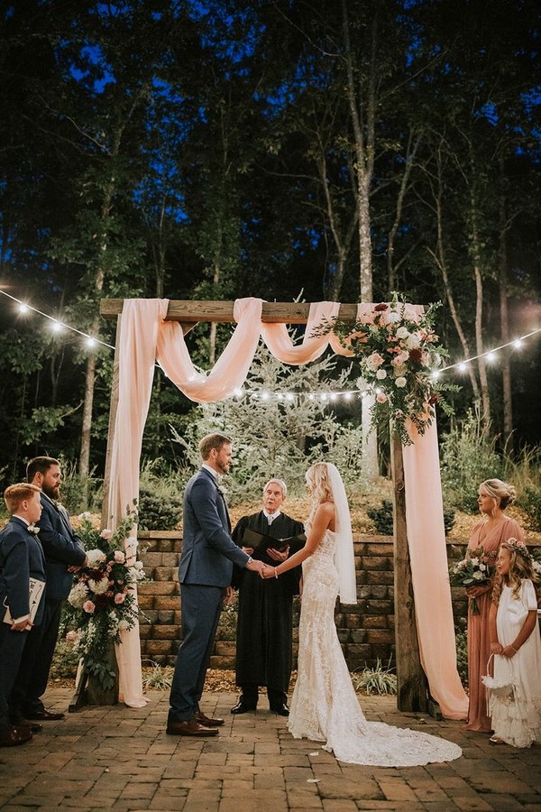 intimate small outdoor night wedding ceremony arch ideas