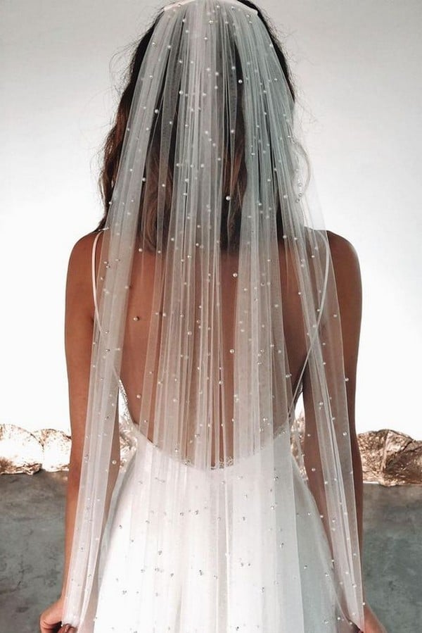 medium wedding hairstyle with long pearl veil