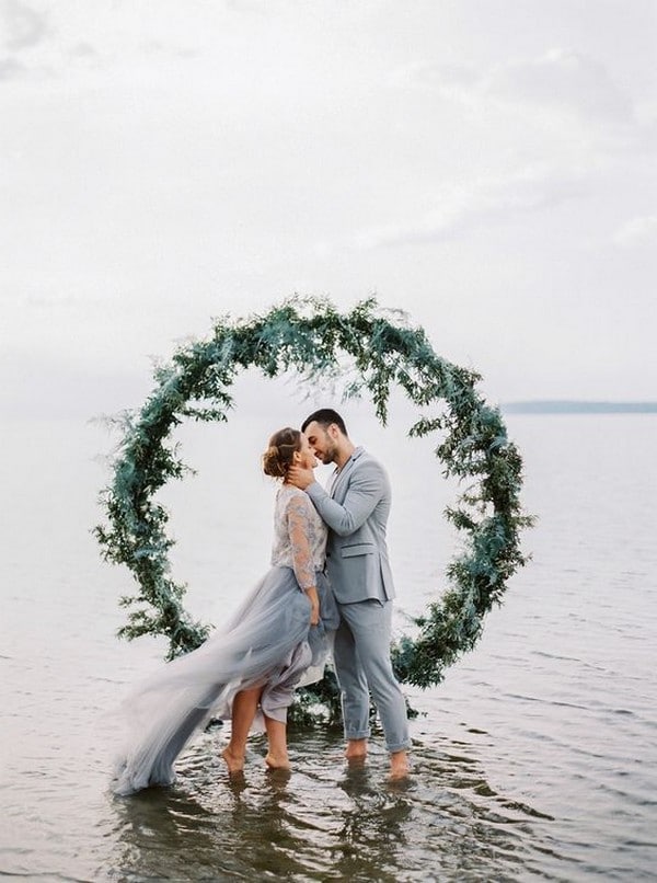 romantic wedding photo with greenery circular wedding backdrop
