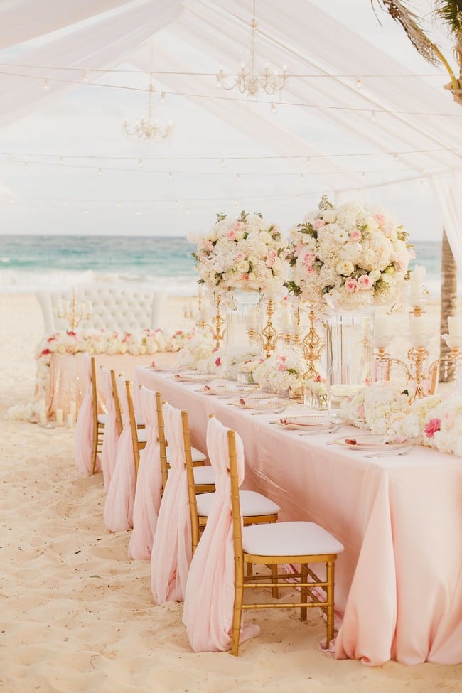 Intimate beach tented blush wedding reception