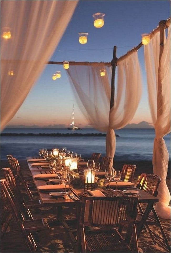 romantic beach night wedding reception with lights