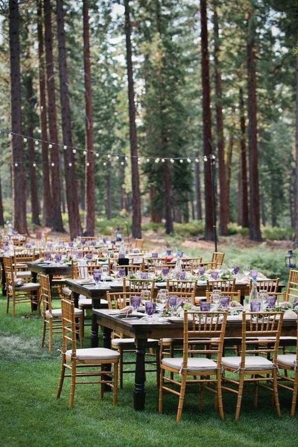 Enchanting wedding reception dinner in the woods