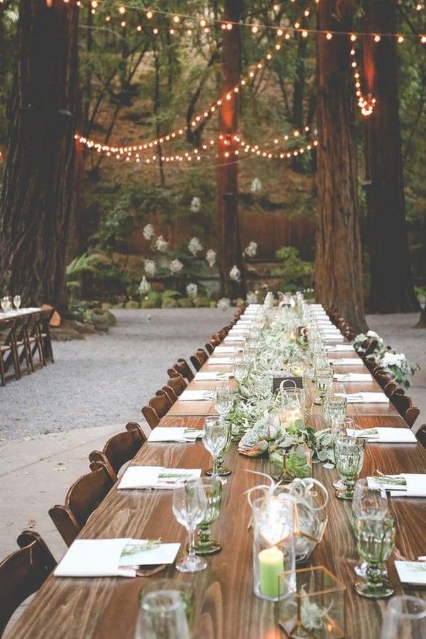 forest themed wedding reception with lights