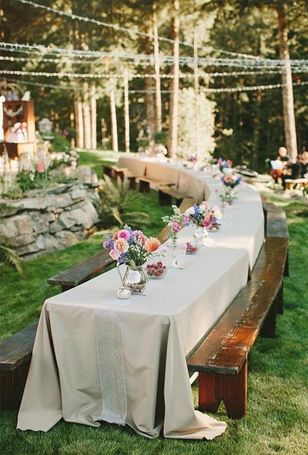 long table wedding reception in the forest