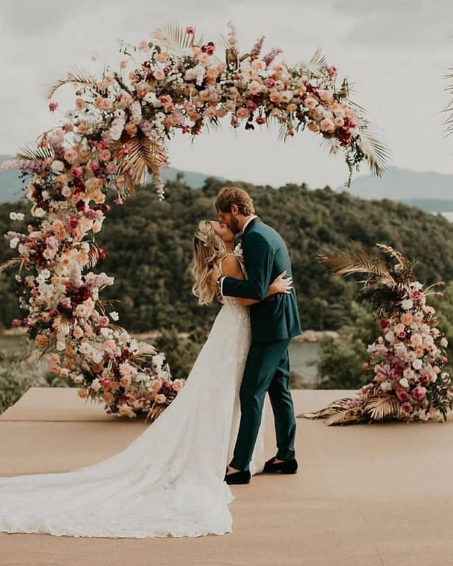 Bride And Groom Under Arch Wedding Photos #wedding #photos #weddingphotos #arches #weddingarches