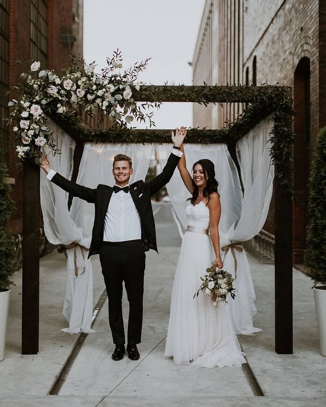 Bride And Groom Under Arch Wedding Photos #wedding #photos #weddingphotos #arches #weddingarches